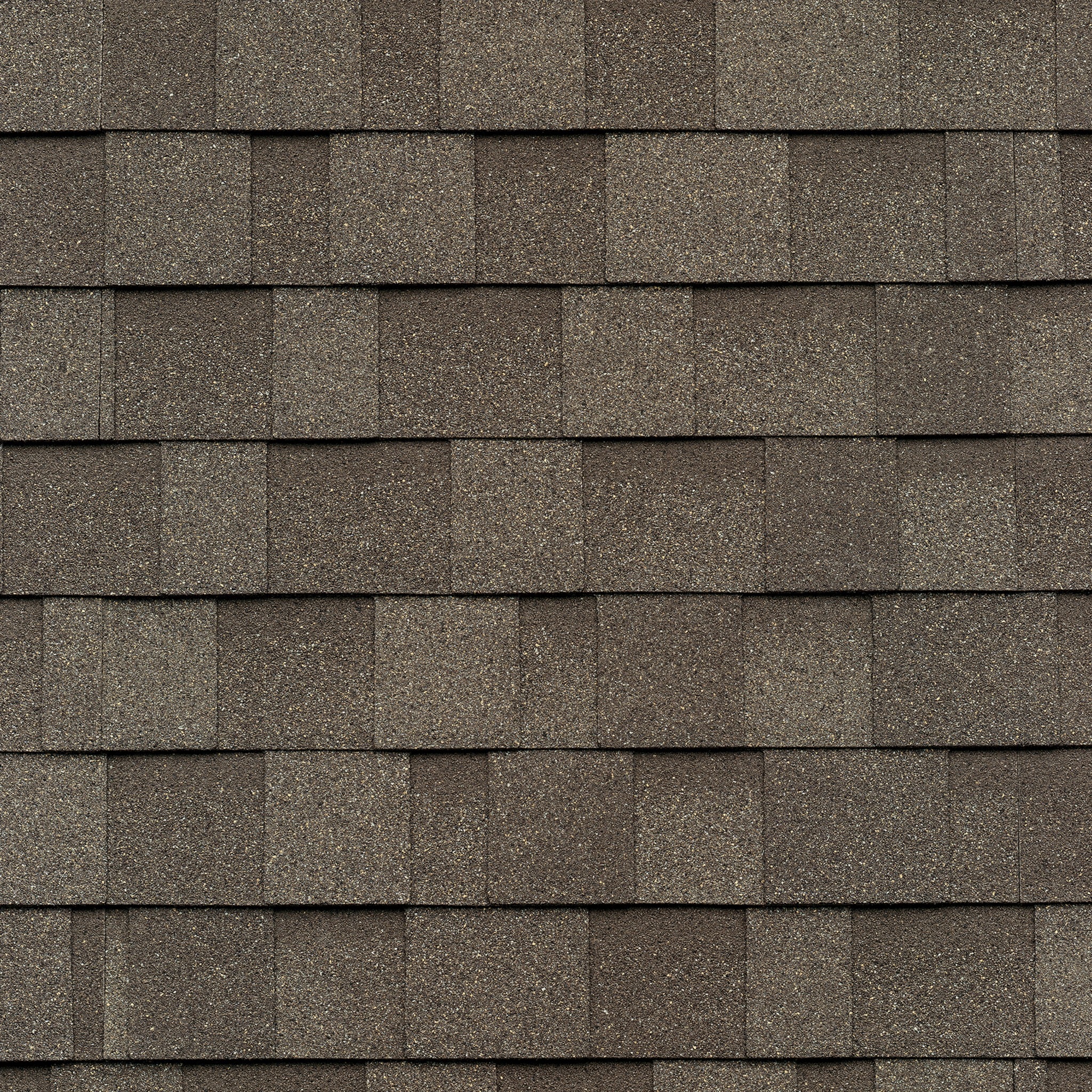 Close-up of a roof with overlapping Cambridge Weatherwood shingles in cool colors, arranged in a uniform pattern.